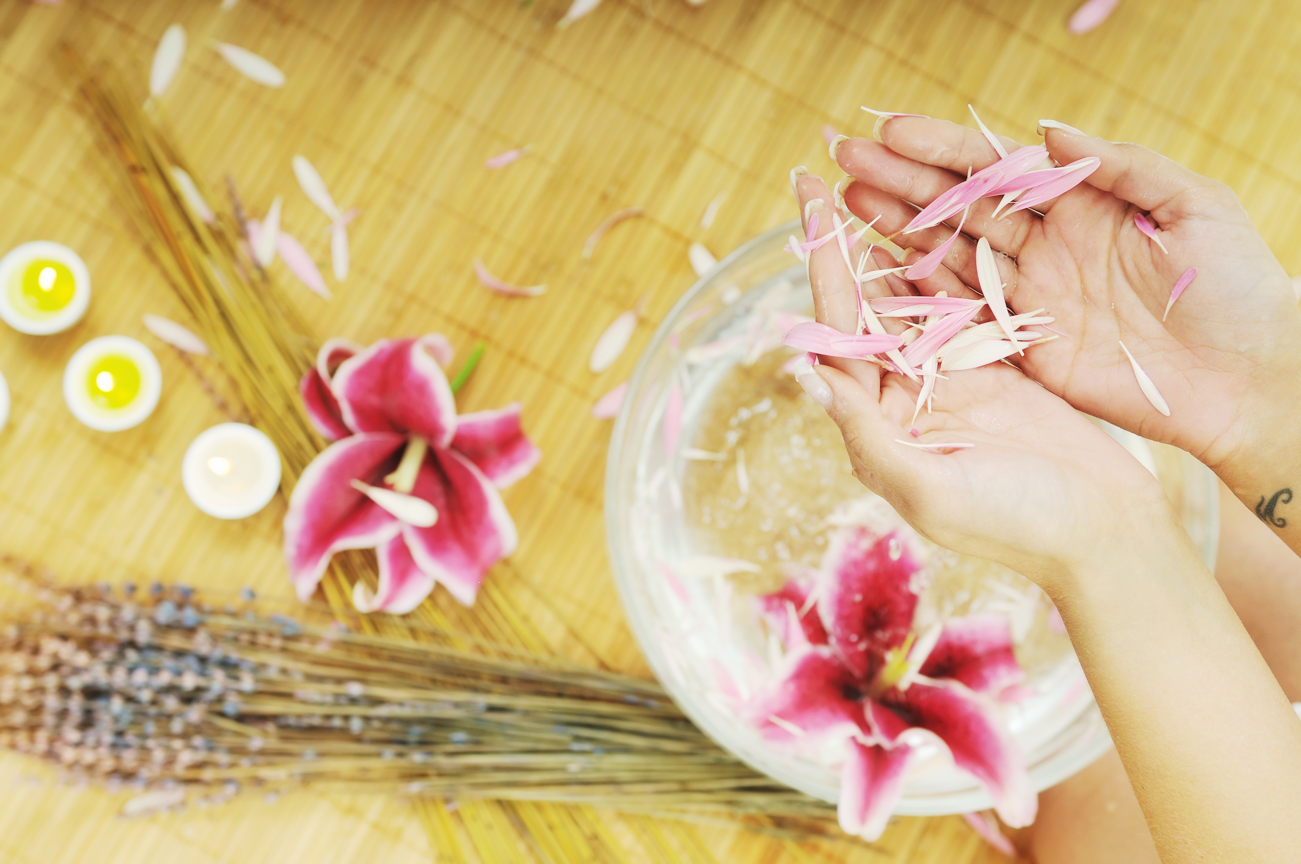hand spa and beauty treatment with aroma and flowers in water